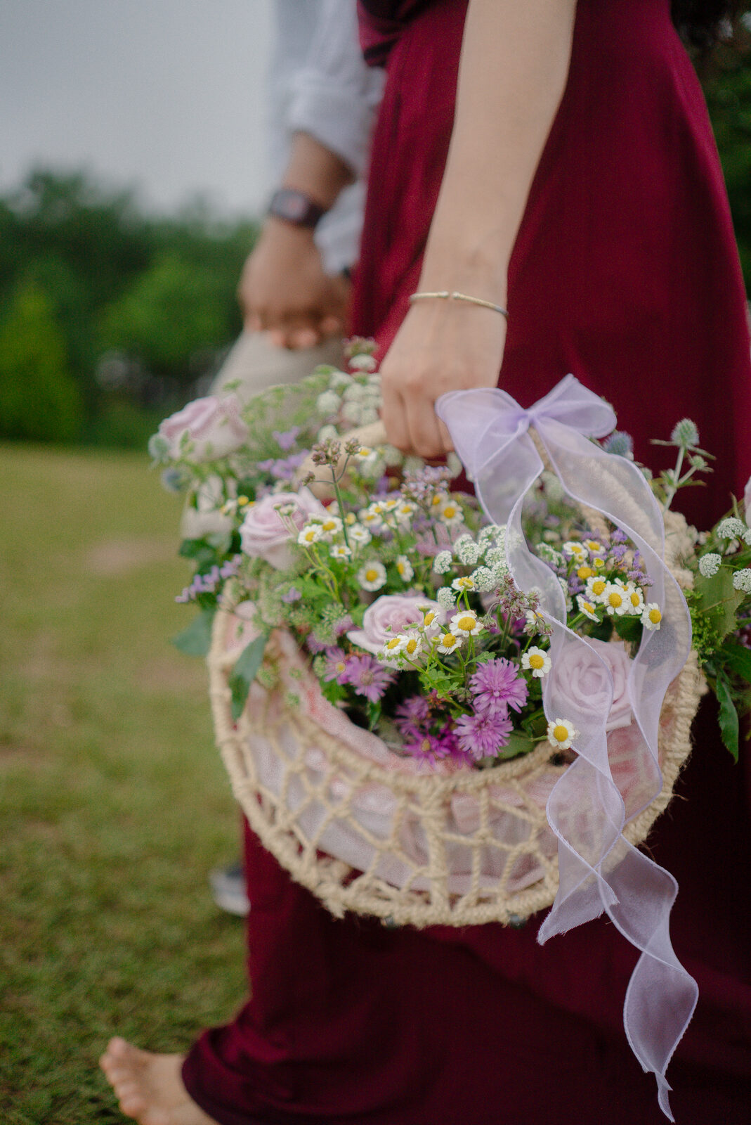 Riya holding a basket of flowers