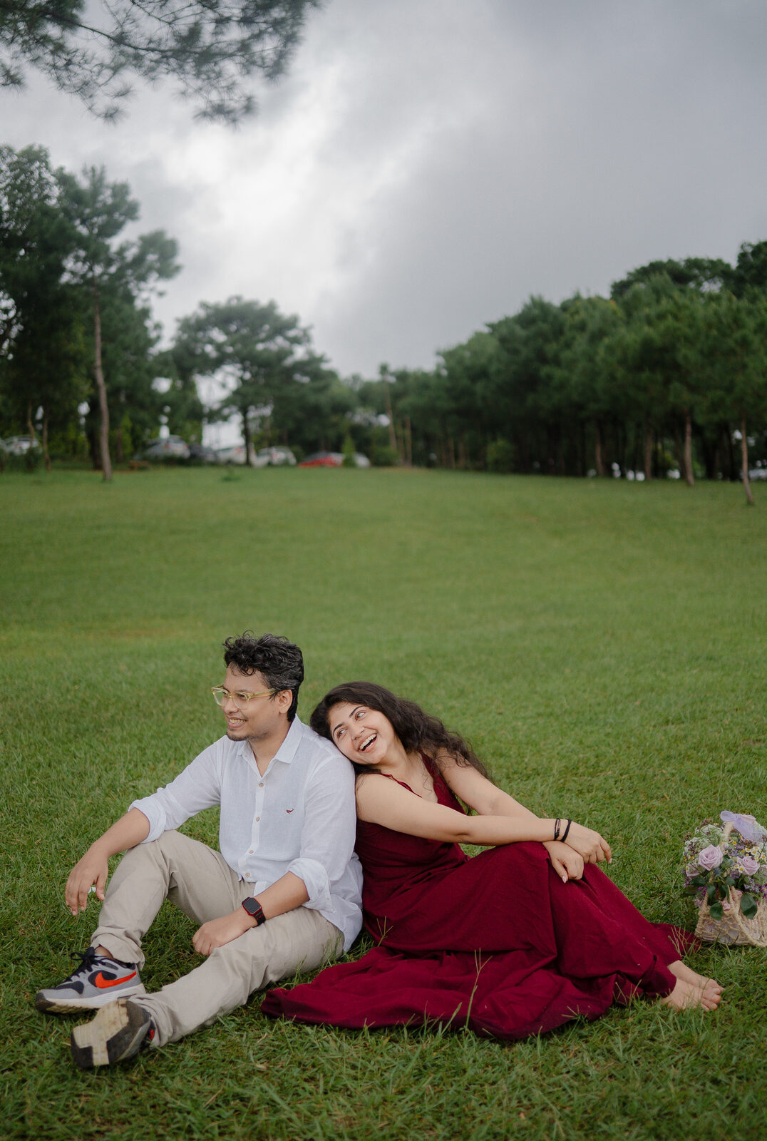 Prateek and Riya seated on the grass